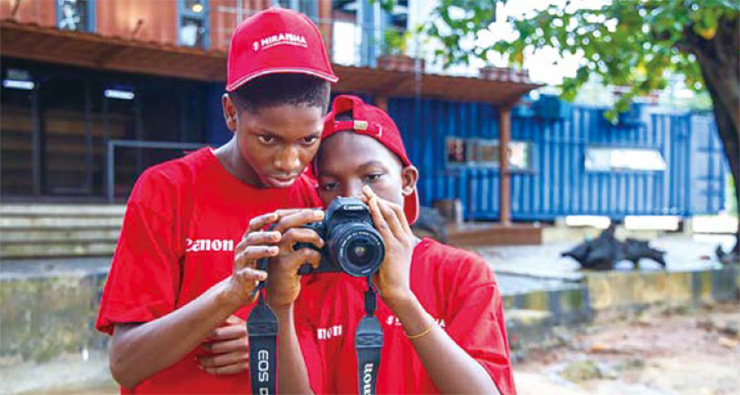 Miraisha students participating in practical hands-on shooting sessions in Nigeria